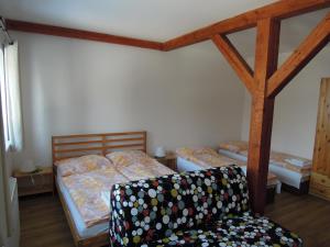 Postel nebo postele na pokoji v ubytování Apartment Vlčice u Trutnova