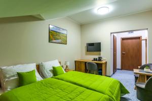 Łóżko lub łóżka w pokoju w obiekcie Szelesiówka & SPA
