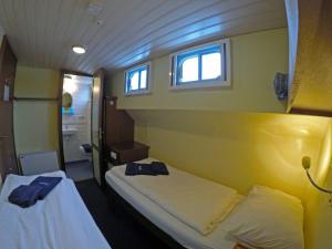 Postel nebo postele na pokoji v ubytování Botel Elodie