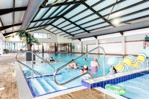 a group of people in a swimming pool at Ladram Bay Holiday Park in Otterton