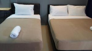 Postel nebo postele na pokoji v ubytování The C Hotel