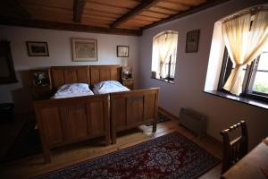 Postel nebo postele na pokoji v ubytování Apartmány pod věží