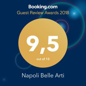 a poster for the quest review awards with a yellow circle at Napoli Belle Arti in Naples