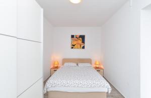 Postel nebo postele na pokoji v ubytování Apartments Ilija 1363
