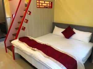 Letto o letti in una camera di Kai Cheng Inn 旅館134