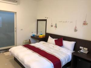 Letto o letti in una camera di Kai Cheng Inn 旅館134