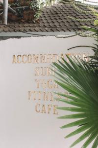 
a sign that is on the side of a building at Dreamsea Canggu in Canggu
