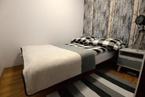 
Łóżko lub łóżka w pokoju w obiekcie Apartament Columbus
