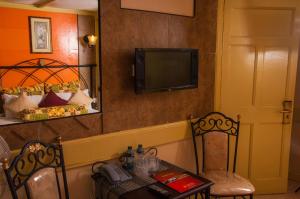 TV a/nebo společenská místnost v ubytování Kahama Hotel Nairobi