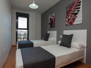Posteľ alebo postele v izbe v ubytovaní For a Stay Las Dunas
