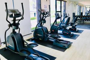 a row of exercise bikes in a gym at The 21 MuangthongThani in Pak Kret