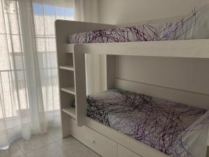 Postel nebo postele na pokoji v ubytování Apartamento David