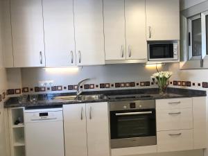 Kuchyň nebo kuchyňský kout v ubytování Apartamento David