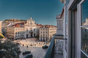 a view of a city street from a window at Europe Lisboa Boutique Hotel in Lisbon +15 photos
