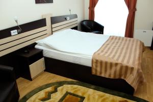 Postel nebo postele na pokoji v ubytování Hotel Zimbru