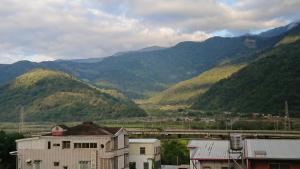 a view of a mountain range with a train station at 里山旅棧民宿 Li Shan Homestay in Fuli