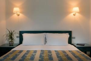 
A bed or beds in a room at Hotel Club Village Maritalia
