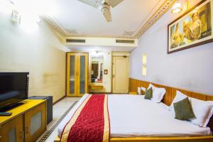 Postel nebo postele na pokoji v ubytování Hotel Shalimar