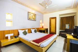 Postel nebo postele na pokoji v ubytování Hotel Shalimar