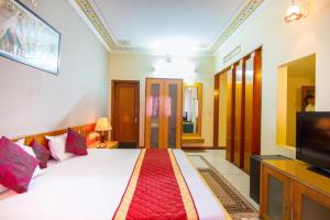 Postel nebo postele na pokoji v ubytování Hotel Shalimar