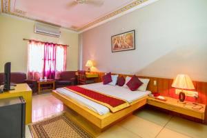 Postel nebo postele na pokoji v ubytování Hotel Shalimar