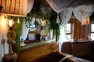 a living room with a couch and a large mirror at Hotel Pelirocco in Brighton & Hove