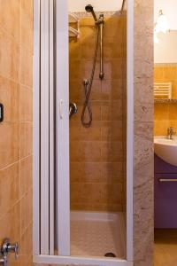 a bathroom with a shower with a tub and a sink at SCIUSCIA' in Alcamo Marina +26 photos