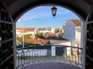 a view from the balcony of a house with an archway at Casa da Retorta in Alcains