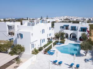 an aerial view of a white building with a swimming pool at Dedalos Studios Naxos in Naxos Chora