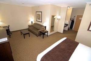 a hotel room with a couch and a living room at Rock Island Inn & Suites in Atlantic
