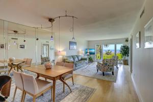 a dining room and living room with a table and chairs at Breakers At Hilton Head in Hilton Head Island