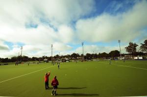 two children are standing on a soccer field at Parkview Motor Inn in Parkes