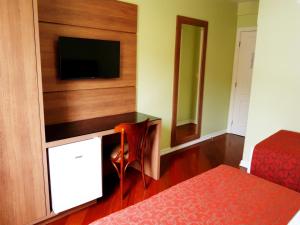 TV a/nebo společenská místnost v ubytování Hotel Pousada Clássica