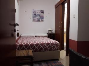 a bedroom with a bed in a room at Marina's Rooms in Larnaca