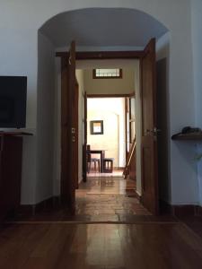 an open hallway with a door leading to a dining room at Quinta Luna in Cholula