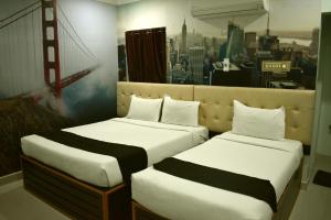 Postel nebo postele na pokoji v ubytování Hotel Apple Park Inn + 20 fotografií