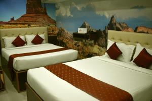Tempat tidur dalam kamar di Hotel Apple Park Inn
