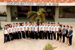 a group of boys and girls standing in front of a building at Hanamitsu Hotel & Spa in Garapan