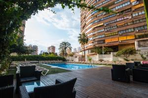 a swimming pool in the middle of a building at Now Benidorm in Benidorm
