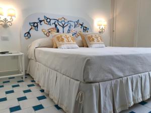 Giường trong phòng chung tại Hotel La Lampara