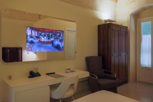 TV a/nebo společenská místnost v ubytování Hotel Casino Ridola