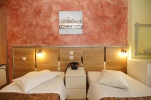 Krevet ili kreveti u jedinici u okviru objekta Socrates Hotel