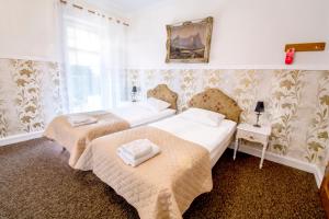 Posteľ alebo postele v izbe v ubytovaní Hotel Garden