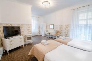 Posteľ alebo postele v izbe v ubytovaní Hotel Garden