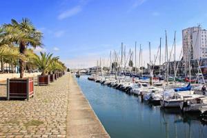 a group of boats docked in a marina at ibis budget Lorient Hennebont in Hennebont