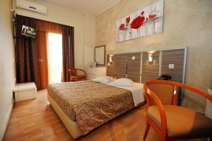 Krevet ili kreveti u jedinici u okviru objekta Socrates Hotel