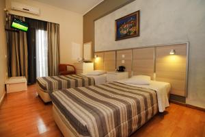 Krevet ili kreveti u jedinici u okviru objekta Socrates Hotel