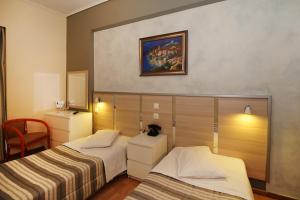 Krevet ili kreveti u jedinici u okviru objekta Socrates Hotel