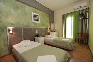 Krevet ili kreveti u jedinici u okviru objekta Socrates Hotel