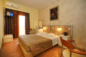 Krevet ili kreveti u jedinici u okviru objekta Socrates Hotel